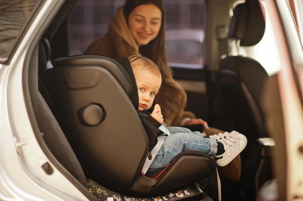 Mom with child in a car seat